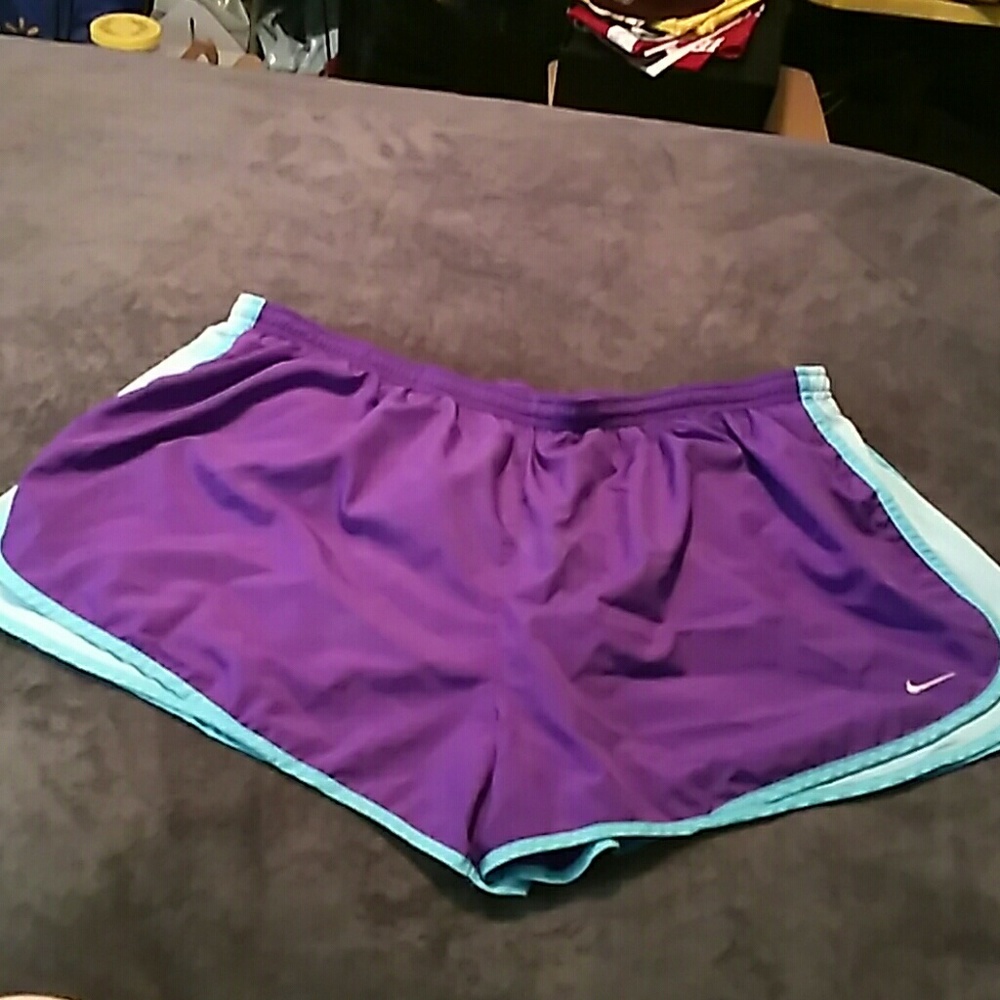 Purple and blue nike tempos
